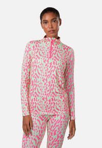 Langsleeve sporttop in lichtgroen met roze dierenprint. Heeft een half-rits kraag en een aansluitend ontwerp, gemaakt van rekbaar materiaal.