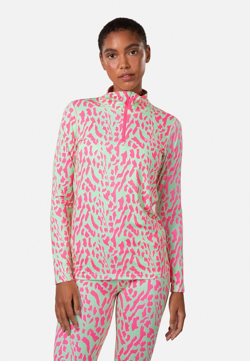 Langsleeve sporttop in lichtgroen met roze dierenprint. Heeft een half-rits kraag en een aansluitend ontwerp, gemaakt van rekbaar materiaal.
