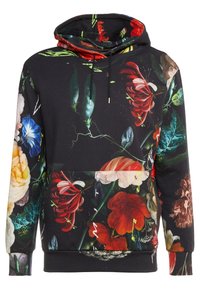 Huvtröja i bomullsmix med svart bas och livfullt blommönster i röd, rosa, blå och grön. Snörningsdetalj.