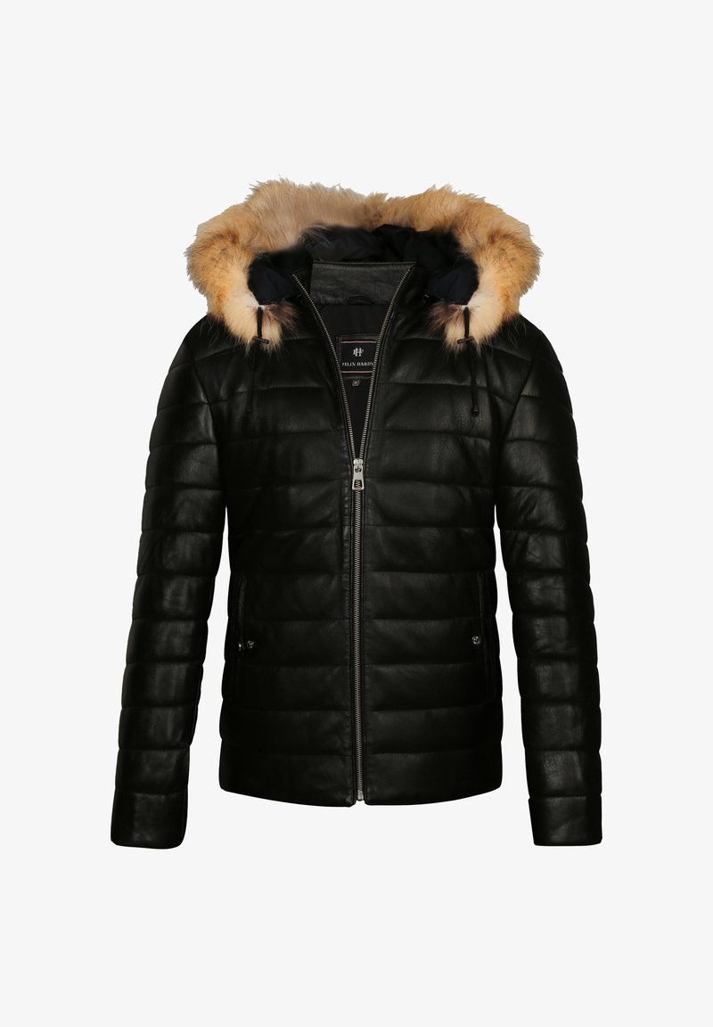 Veste matelassée noire avec fermeture éclair à l'avant et capuche doublée de fourrure marron, manches longues et poches latérales.