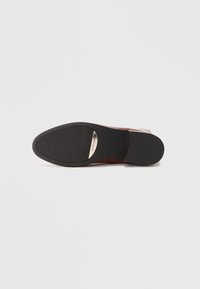 Brown leather shoe with a smooth upper, a rounded toe, and a curved black rubber sole. Silver accent near the heel. Flat design.