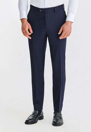 - Spodnie materiałowe