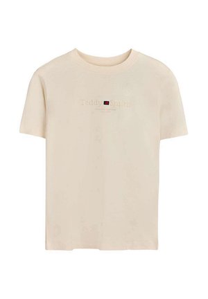 T-shirt beige à manches courtes et col rond avec logo "Teddy Smith" brodé et petit détail en carré rouge et noir sur la poitrine.