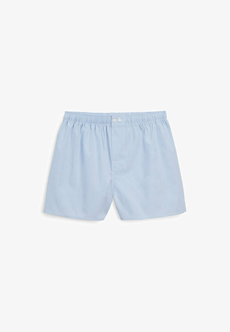 Light blue cotton boxer shorts with an elastic waistband, buttoned fly, and subtle diagonal texture. Simple, functional design.