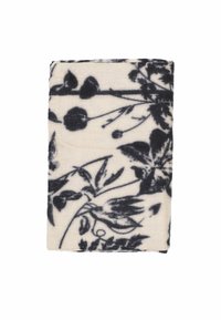 Coperta con motivo floreale su base crema e accenti blu scuro. Texture morbida, forma rettangolare, presenta dettagliati disegni botanici.