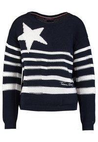 Marinblå och vit randig stickad tröja med stjärndesign, ribbade ärmar och nederkant, som har strukturerade mönster och "Team Tommy" broderat i vitt.