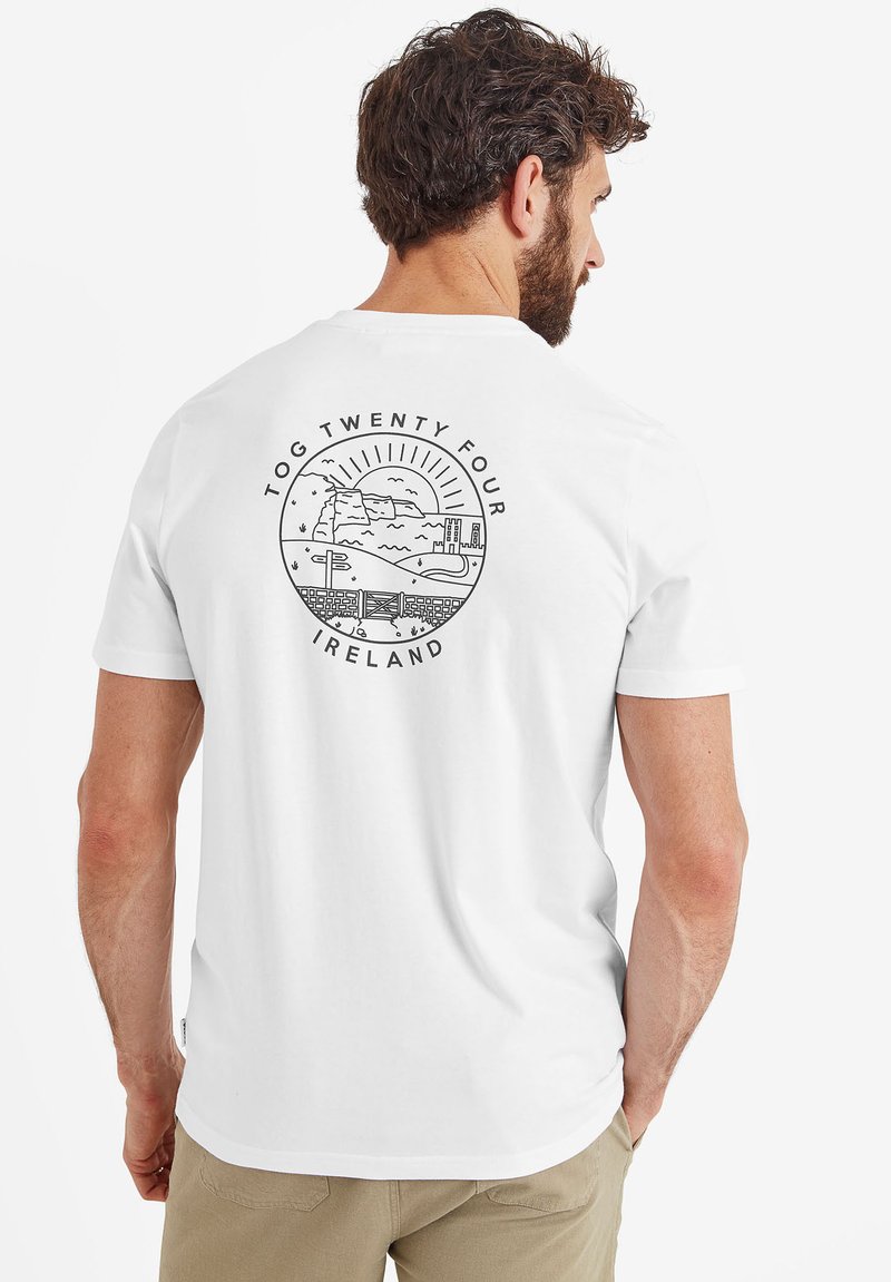 White cotton t-shirt with a round graphic design on the back featuring a landscape and text "TOG TWENTY FOUR IRELAND." Short sleeves.