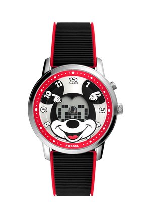 Reloj de pulsera redondo con correa negra y roja, con una cara sonriente de personaje de dibujos animados y manecillas en forma de mano señalando la hora y los minutos.