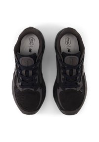 Dark gray athletic shoes with mesh and synthetic upper, round toe, black laces, and subtle branding on the tongue and insole.