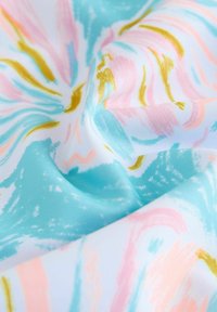 Lightweight fabric with a swirl pattern in turquoise, pink, and yellow hues. Features smooth texture and colorful brushstroke designs.