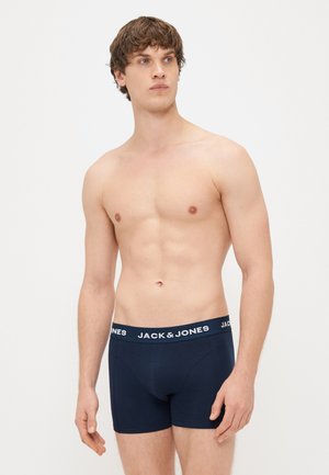 Boxers de couleur bleu marine avec ceinture élastique arborant le logo "JACK & JONES". Fabriqués en tissu lisse, au design près du corps.
