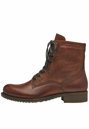 Brown leather ankle boot with textured finish, round toe, lace-up front, and a low block heel. Features metal eyelets and contrasting stitching.