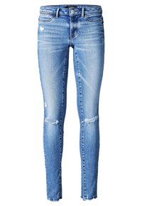 Jeans ajustados de denim azul, con detalles desgastados y dobladillos deshilachados, en un diseño clásico de cinco bolsillos y con una cintura de altura media.