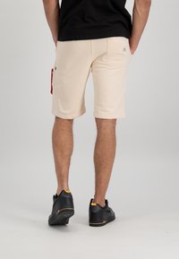 Alpha Industries X-FIT - Donji dijelovi trenirke - jet stream white