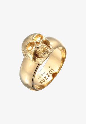 Guldfarvet ring med et kraniedesign på en glat ring. Præget med "KUZZOI" og detaljer om sølvrenshed inde i ringen.