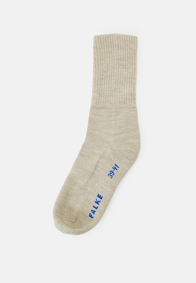 Calzino beige a coste realizzato in materiale morbido, con punta arrotondata e logo blu con indicazioni delle taglie stampato sul lato.