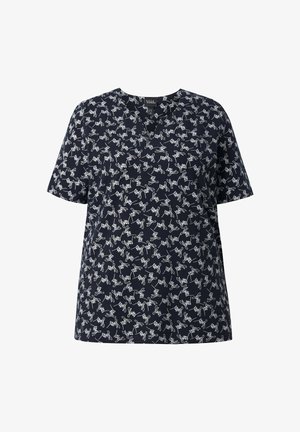 Blouse bleu marine à manches courtes avec motif gribouillis abstrait blanc et encolure arrondie, présentée sur fond blanc.