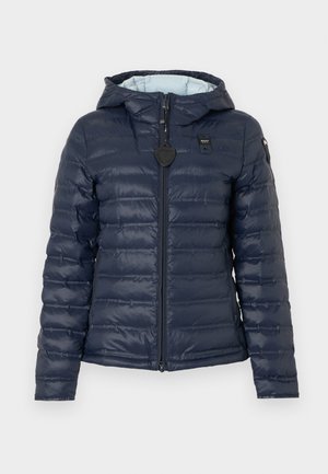 Navy blue quilted jacket with front zipper, hood, and logo patches on chest and left sleeve.