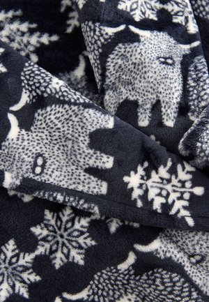 Sinine fliisiste tekk tekstuuriga valgete elevandi- ja lumehelbepatroonidega. Pehme, soe materjal siledapoolse viimistlusega ja kattuvate kihtidega.