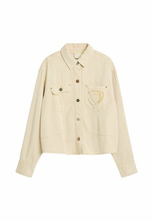 Veste beige à boutons avec col, deux poches poitrine avant, dont une avec un écusson effiloché orné d'un emblème "D" cousu.
