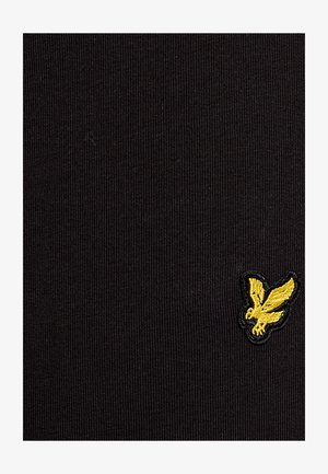 Tissu noir texturé présentant un petit logo brodé jaune représentant un oiseau. Le design est simple avec un motif côtelé.