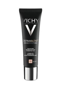 Black squeeze tube of Vichy Dermablend foundation, with silver cap, labeled “30 Beige.” Text highlights corrective and long-lasting features.