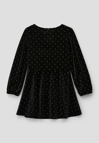 Schwarzes Samtkleid mit langen Ärmeln, verziert mit weißen Punkten, Rundhalsausschnitt und einem ausgestellt Rock. Knöpfverschluss hinten.