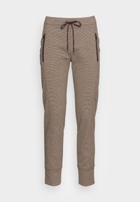 Pantalon de jogging marron à motifs avec une coupe fuselée, taille à cordon de serrage et deux poches latérales zippées. Confectionné dans un tissu doux et texturé.