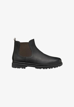 Stivale Chelsea in pelle nera con pannelli laterali elastici e linguetta sul retro, con suola spessa e scolpita in gomma.