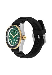 Michael Kors óra zöld számlappal, arany kerettel, fekete forgatható kerettel és fekete szilikon szíjjal, 10:10:30 időpontot mutat.