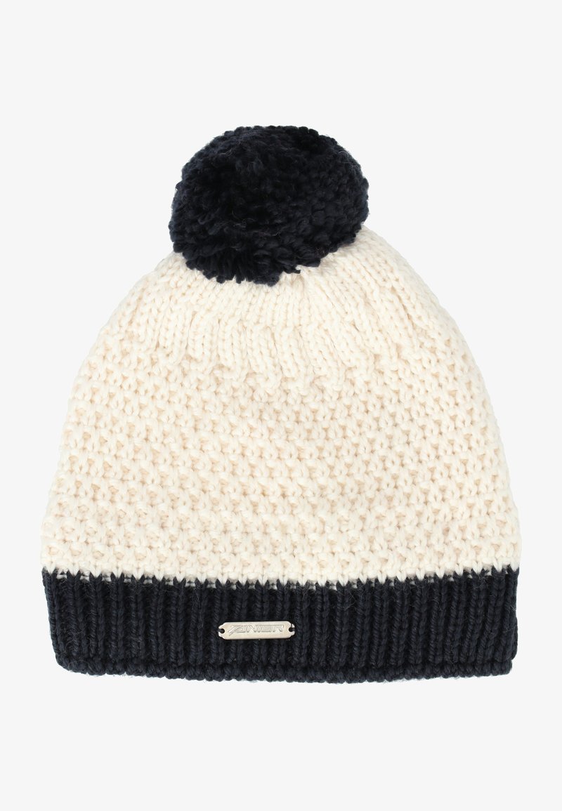 Strikket hue i creme og marineblå, med en tekstureret krop, ribbet marineblå manchet og en fluffy marineblå pom-pom på toppen. Metalllogo detaljer inkluderet.