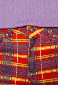 The Ragged Priest Jean flare - multi-coloured