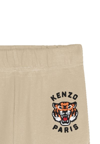 Tanskleurige katoenen sweatpants met een zwart-oranje geborduurd tijgerlogo en de tekst "KENZO PARIS" eronder. Elastische tailleband.