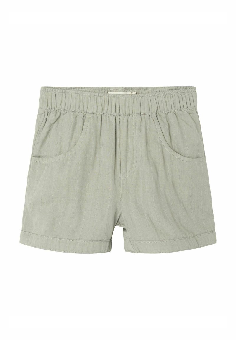 Ljusgröna shorts gjorda av ett mjukt tyg, med resårmidja, två sidofickor och uppvikta fållar.