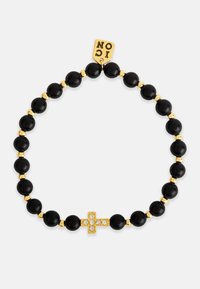 Bracciale di perle nere con accenti dorati, caratterizzato da un'ornamentazione a croce dorata con gemme trasparenti. Etichetta attaccata con la scritta "ICON" in rilievo.