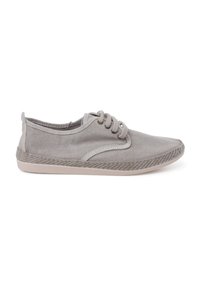 Light gray canvas shoe with a textured finish, round toe, and three lace holes. It features a soft inner lining and a flat rubber sole.