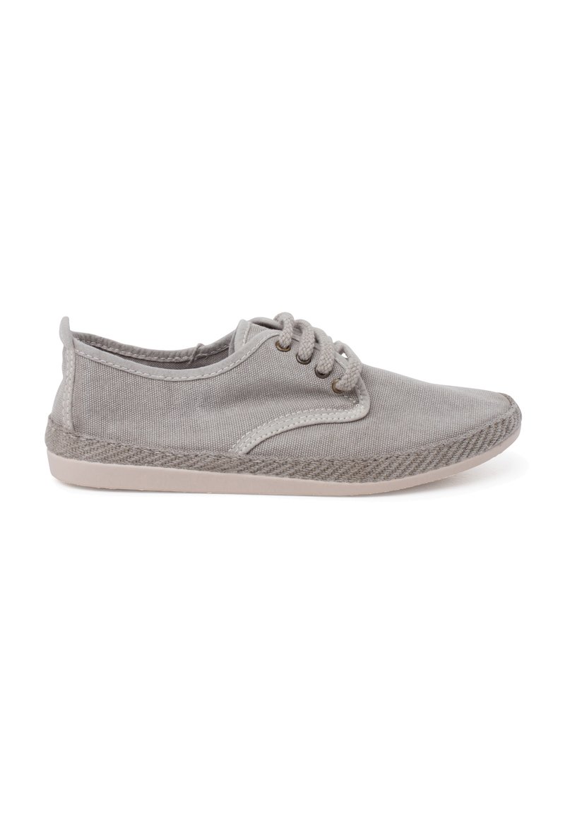 Light gray canvas shoe with a textured finish, round toe, and three lace holes. It features a soft inner lining and a flat rubber sole.