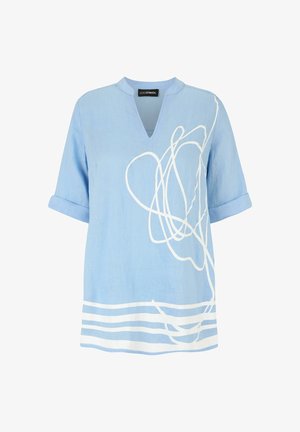 Light blue short-sleeve blouse with rolled cuffs, white abstract line design on front, and small V-neck collar.
