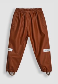 Pantalones impermeables marrones con una cintura elástica, bolsillos laterales y correas ajustables en los tobillos. Presentan etiquetas blancas en ambas piernas.