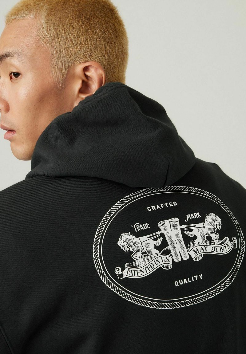 Levi's® RELAXED GRAPHIC - Sweat à capuche - black
