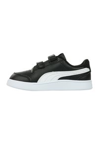Sneaker sintetica nera con accenti bianchi, cinturini in Velcro, profilatura bassa, suola testurizzata e dettagli di cucitura sottili sui lati.
