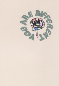 White fabric featuring a central graphic with the text "YOU ARE DIFFERENT" in green, surrounding a colorful lollipop design with black accents.