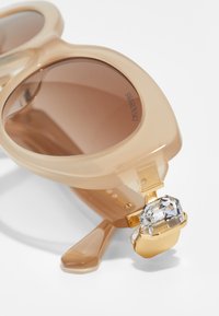 Swarovski Solbriller - beige/brown