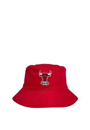 Red bucket hat made of fabric, featuring an embroidered bull logo on the front. Wide brim with a smooth texture.