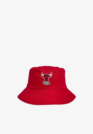 Red bucket hat made of fabric, featuring an embroidered bull logo on the front. Wide brim with a smooth texture.