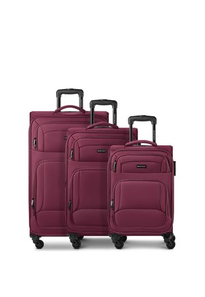 Three maroon soft-shell suitcases with telescopic handles and four wheels, arranged by size from largest to smallest.