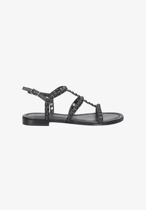 Schwarze flache Sandalen mit einem Riemen-Design, ausgestattet mit kleinen Nieten entlang der Riemen, verstellbarem Knöchelverschluss und einer glatten Lederinnensohle.
