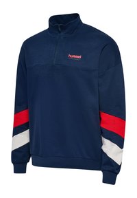 Pullover in fleece blu navy con colletto a mezza zip. Presenta strisce a zigzag rosse e bianche sulle maniche e un piccolo logo "hummel" sul petto.