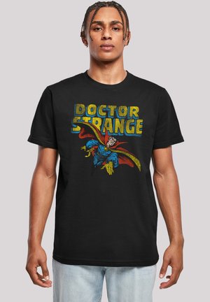 Black cotton t-shirt featuring a colorful "Doctor Strange" graphic with a character in a blue costume and red cape against a yellow background.