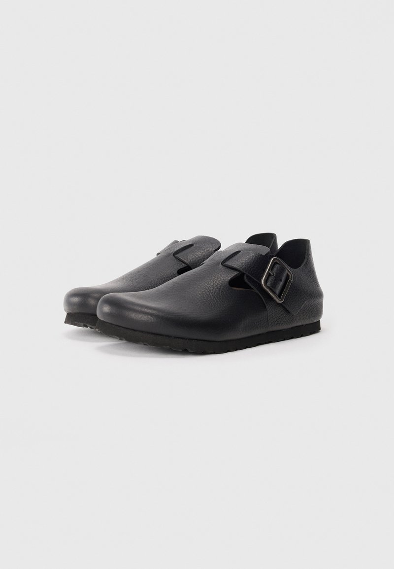 Black leather shoes with a smooth texture, featuring a side buckle closure and a rounded toe design. Rubber sole with traction.